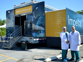 Dr. Ivan Pena Sing and Dr. Mouhanad Freih in front of the Impella Mobile Learning Lab.